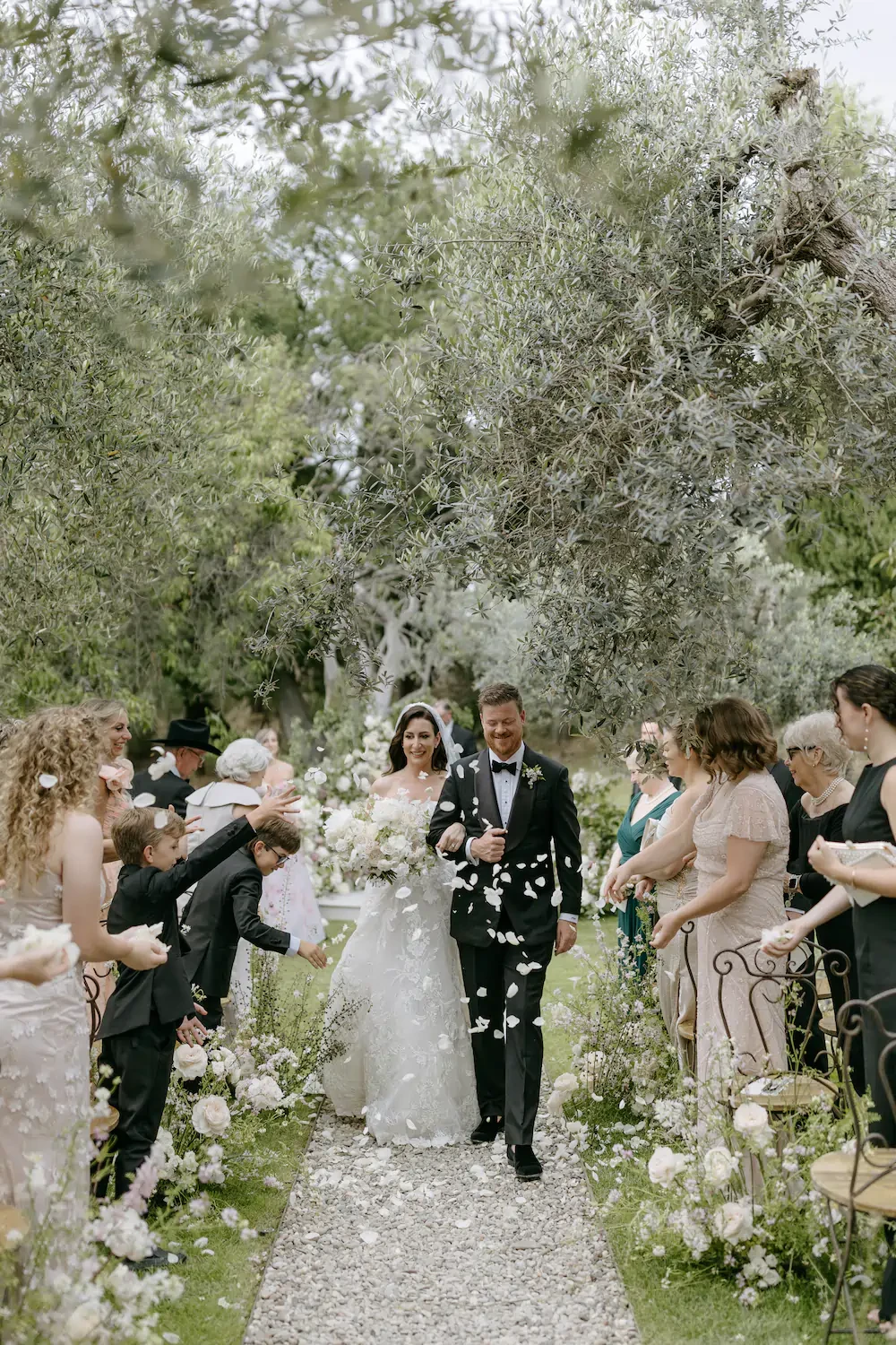 Newlyweds Walking Down Aisle During Petal Toss Recessional