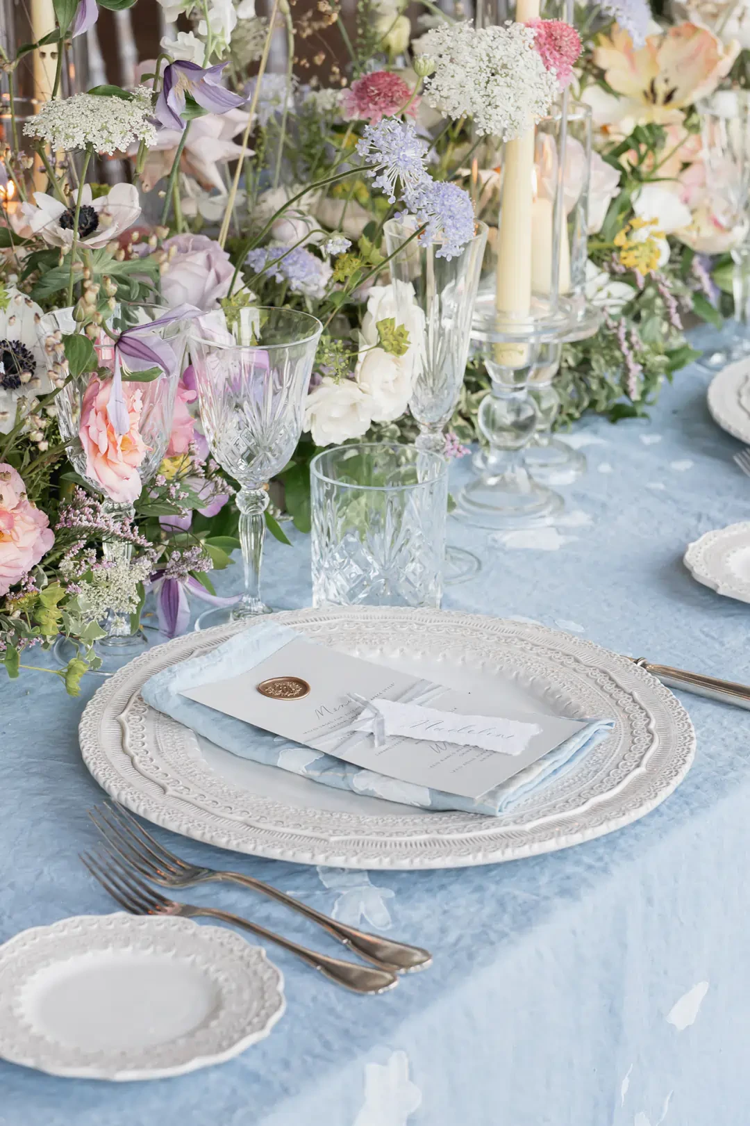 wedding place setting with menu and flowers