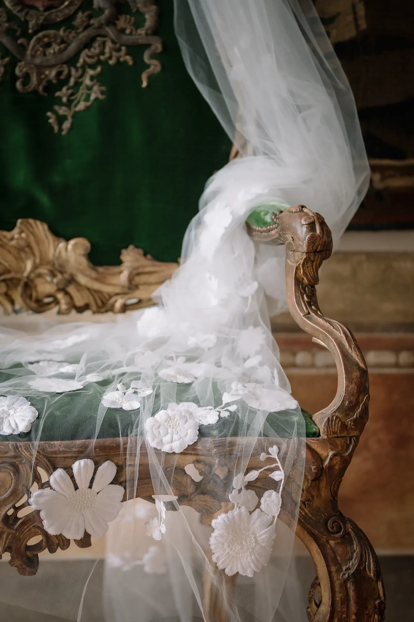 detail of wedding dress on a chair 