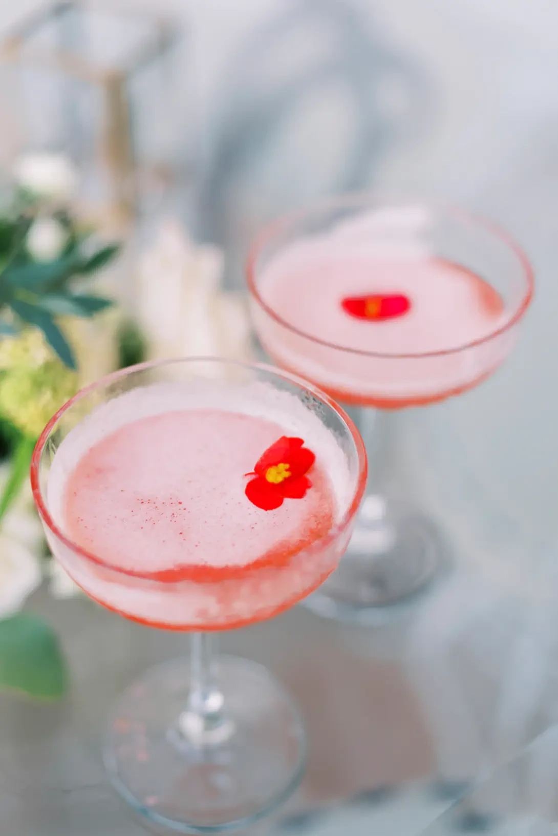 Pink cocktail with flowers