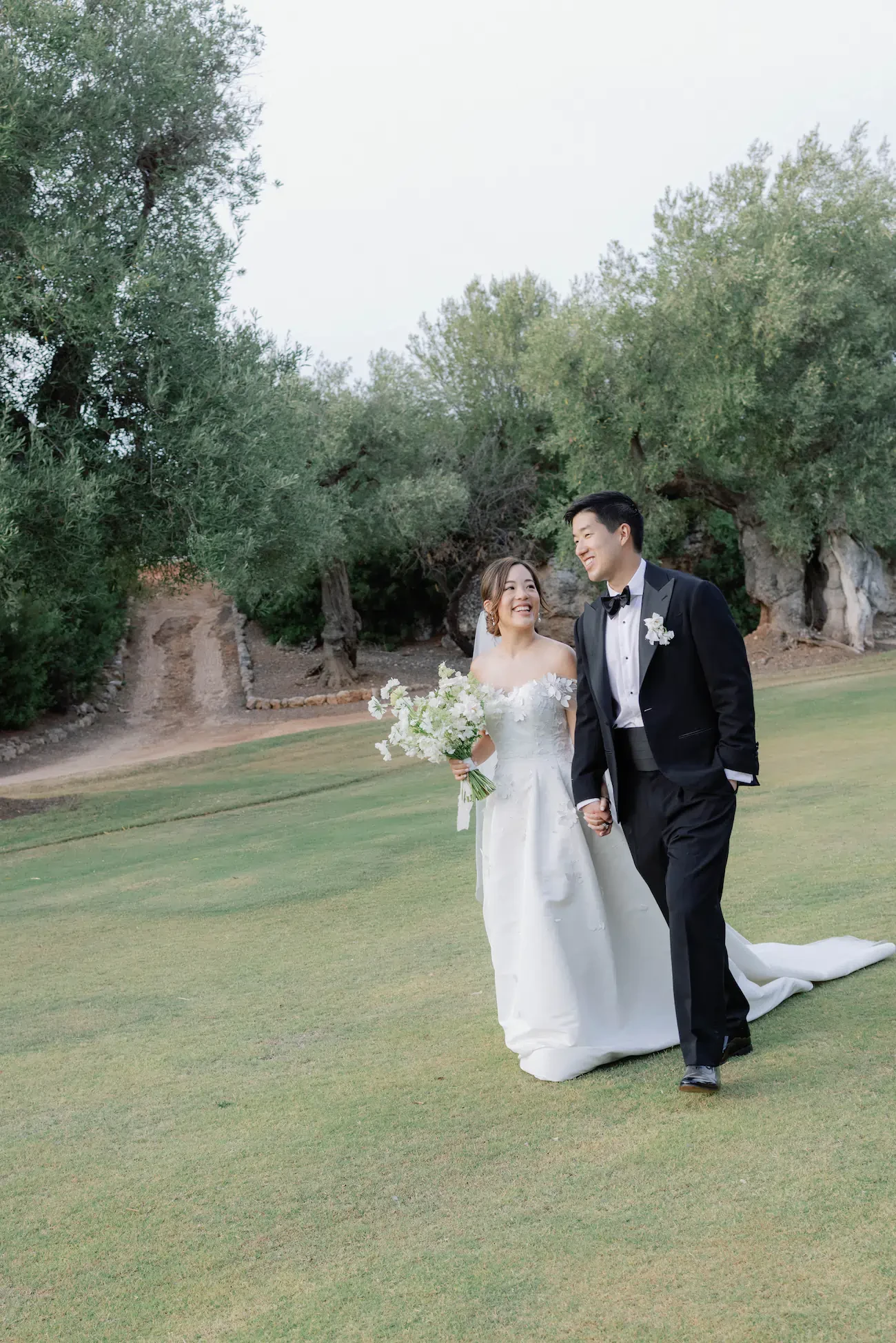 Puglia Masseria Wedding Bride And Groom Walk In Olive Grove