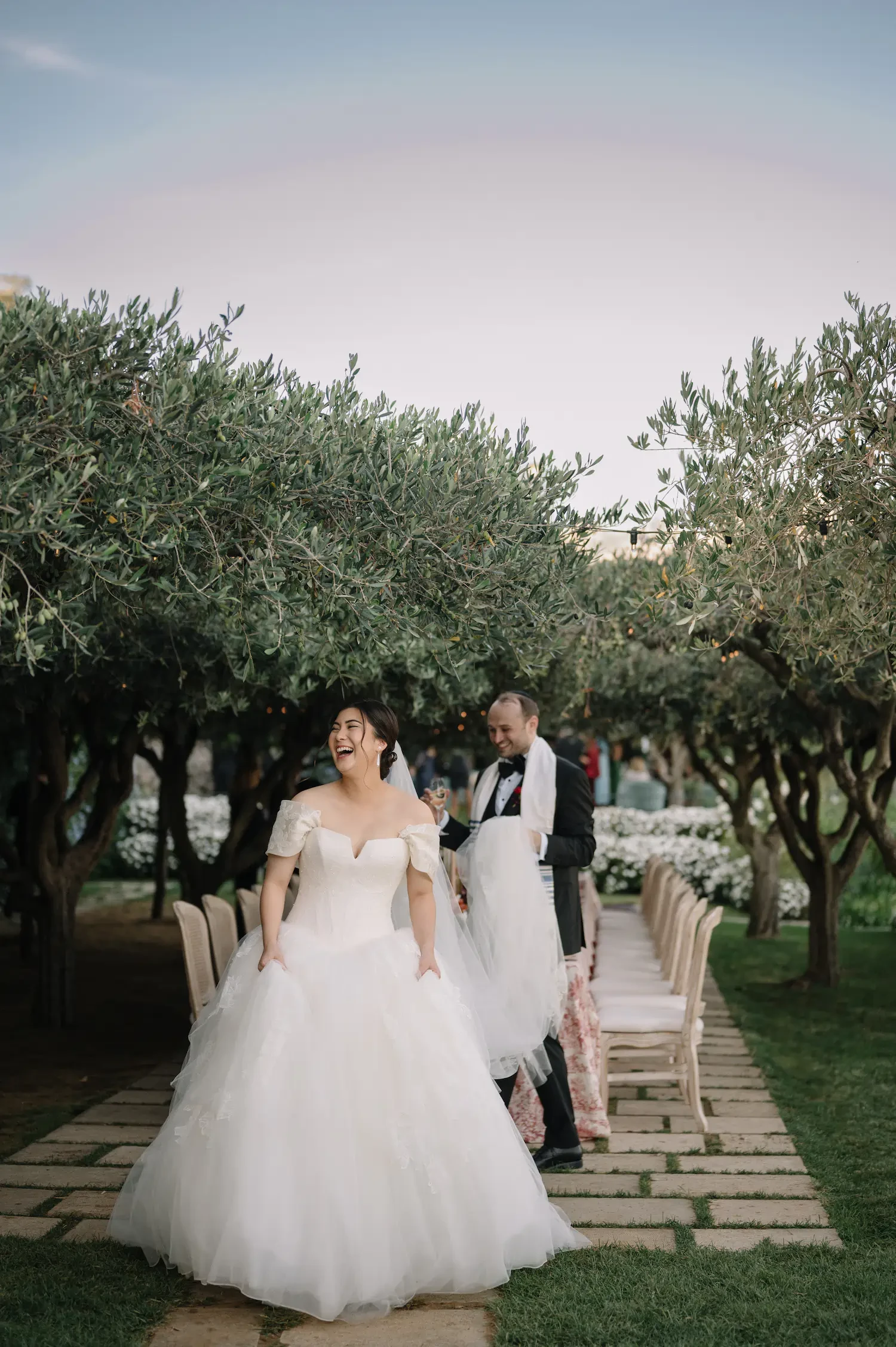 Bride and Groom's Serene Stroll in the Gardens of Hotel Caruso