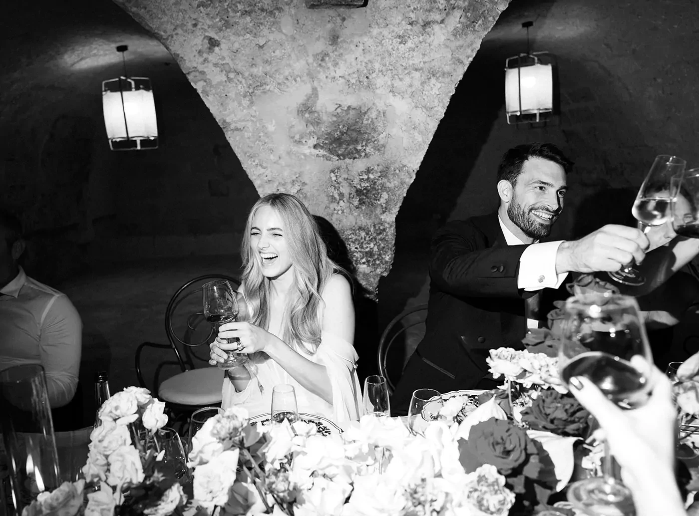 Newlyweds having a toast at the wedding dinner
