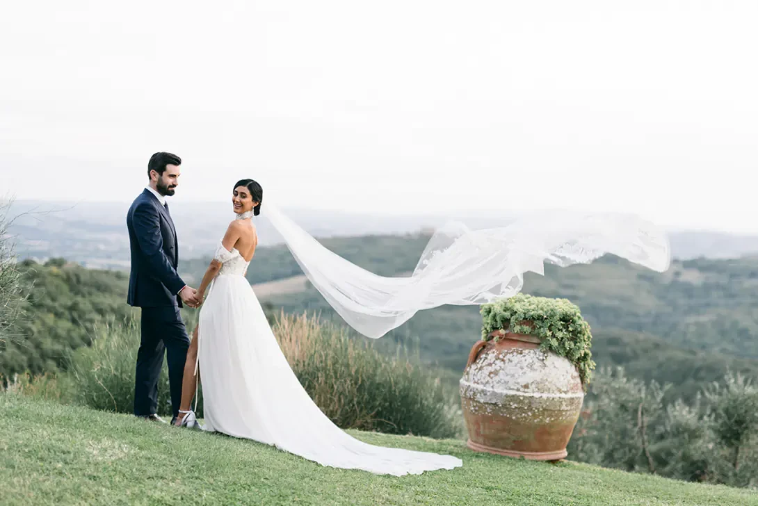 Bride and groom on the Tuscan hills