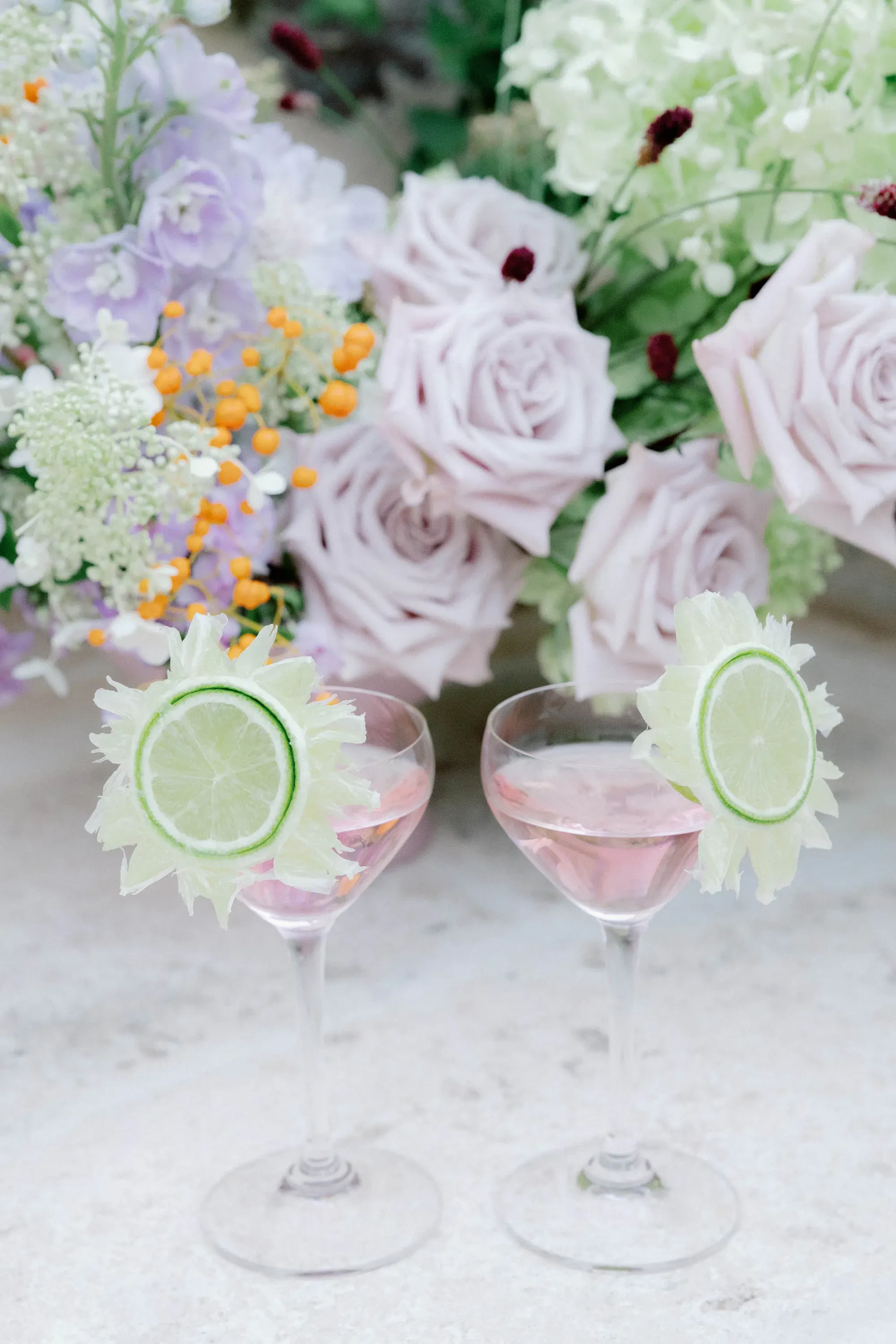 Pink Signature Wedding Cocktails With Lime Garnish