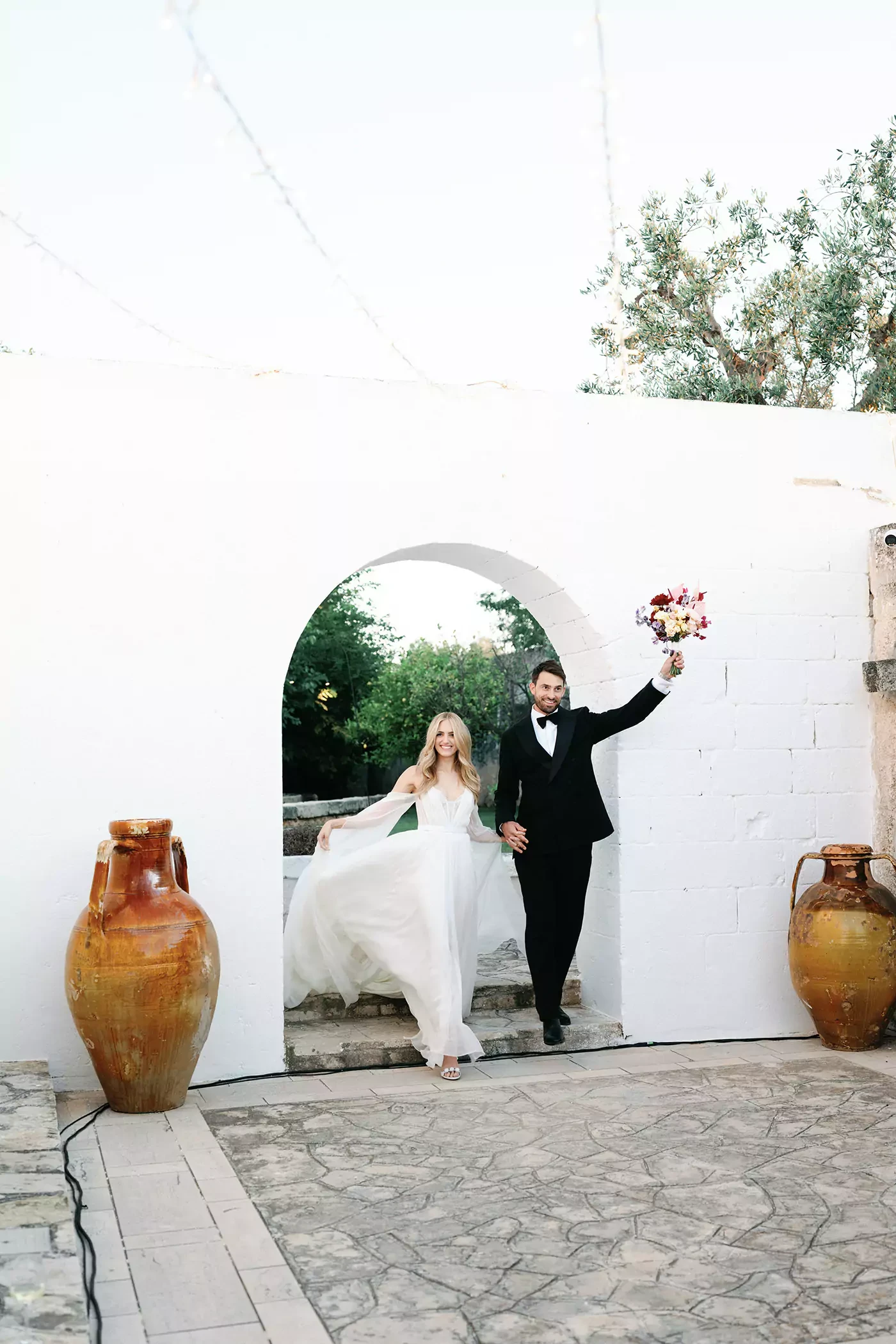 Newlyweds joining the wedding reception at the masseria