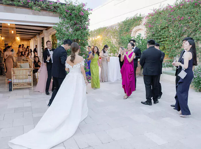 Bride And Groom Grand Entrance To Wedding Reception Courtyard